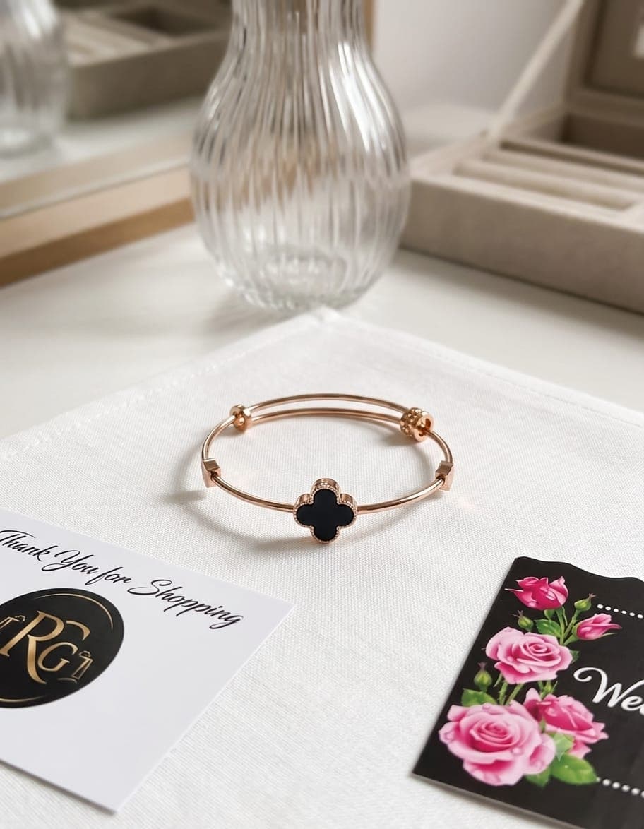Title: Elegant Black Clover Charm Bracelet – Golden Finish